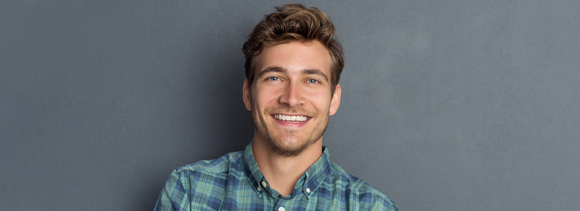 Smiling man after receiving dental implants in Cambridge