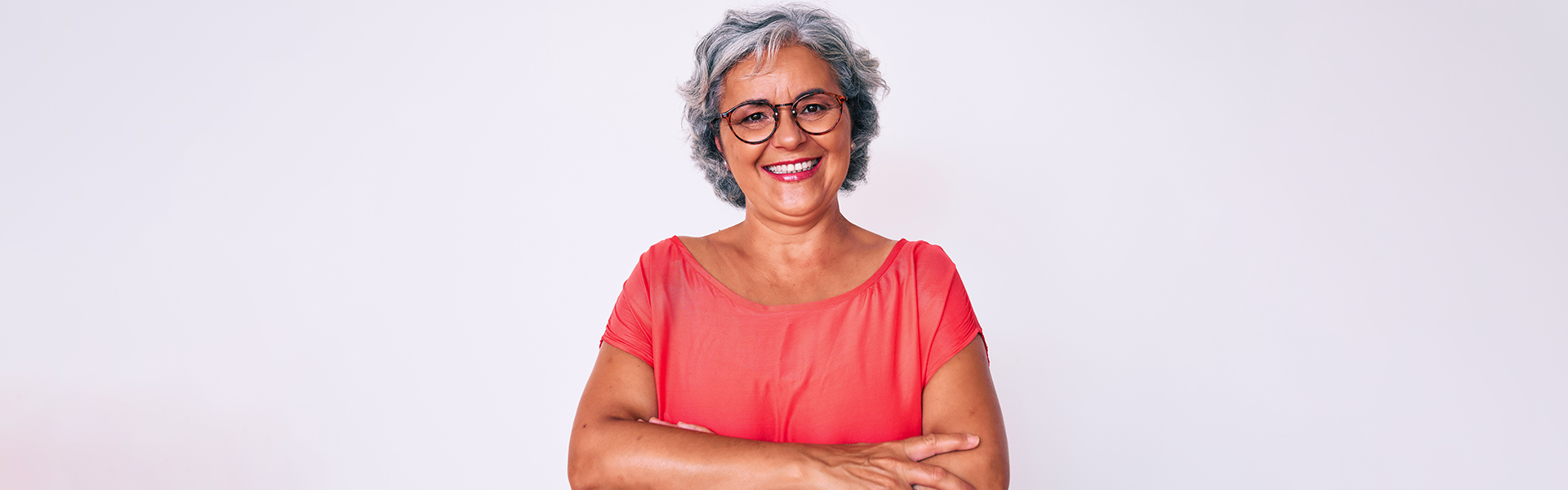 Smiling senior woman after receiving dentures in Cambridge