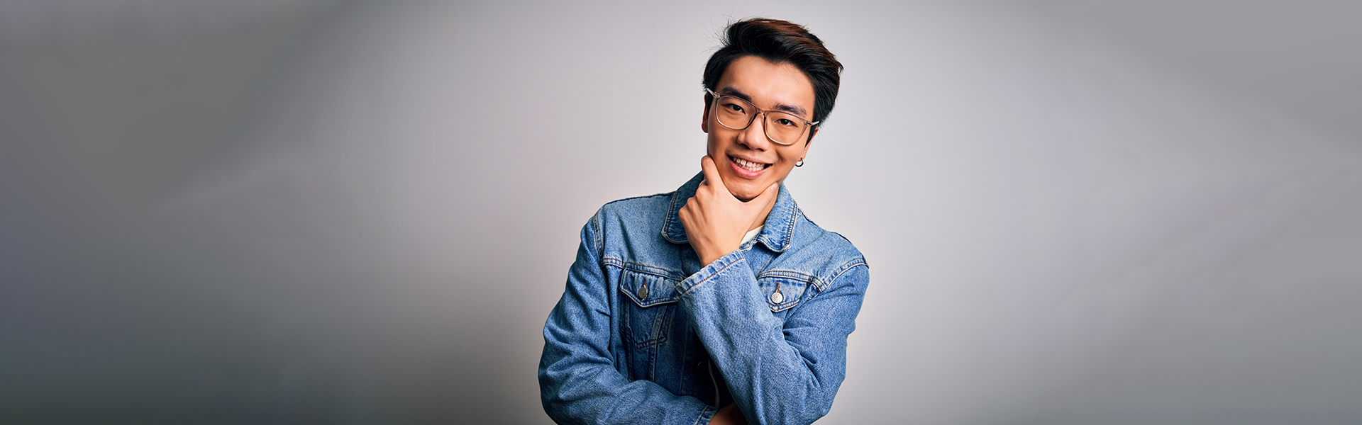 Smiling young man after professional teeth whitening in Cambridge