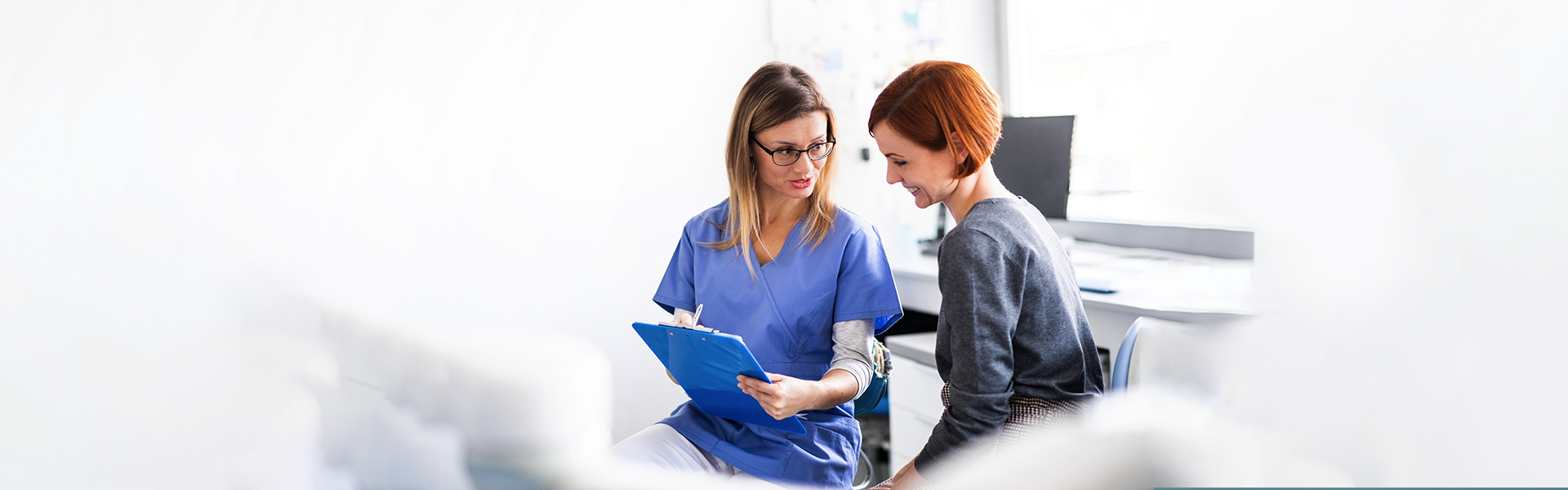 Dentists reviewing patient records for restorative dental services in Cambridge