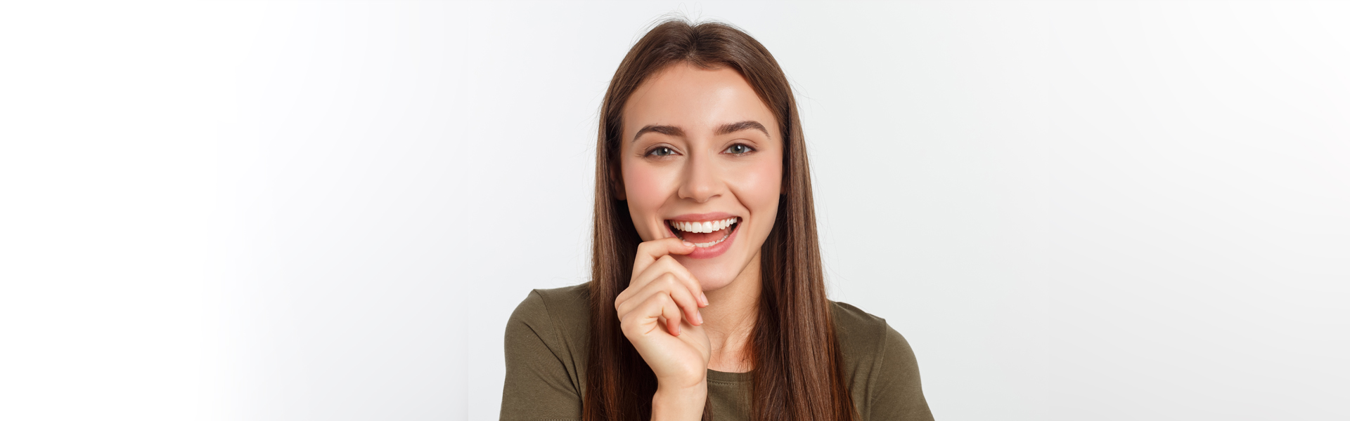 Confident woman smiling after restorative dentistry in Cambridge