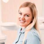 Smiling man and woman after successful dental treatments at Dental Art Clinic in Cambridge.