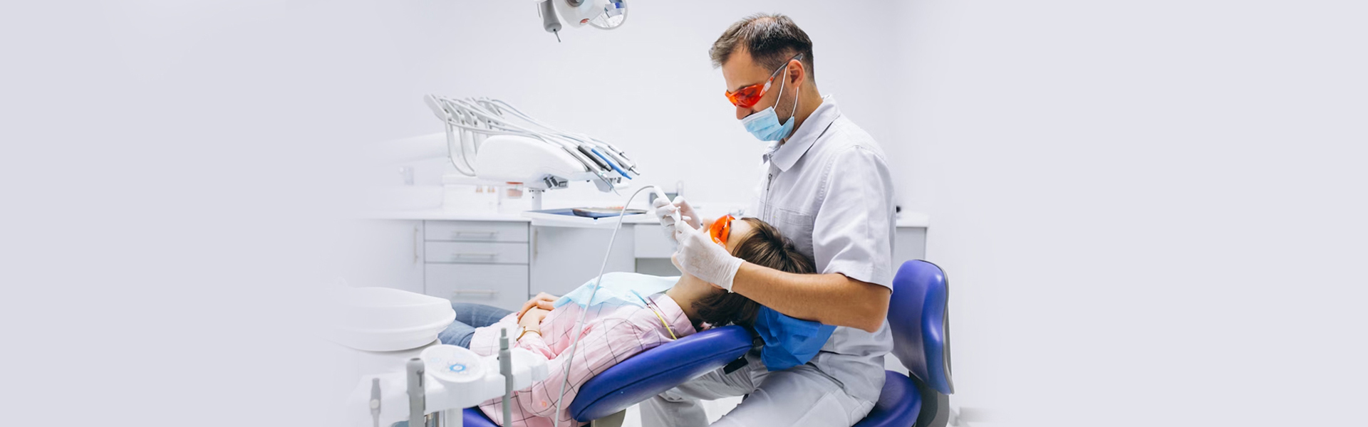 Dentist performing root canal treatment on patient in Cambridge