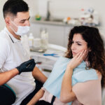 Dentist consulting a woman about her dental treatment options.