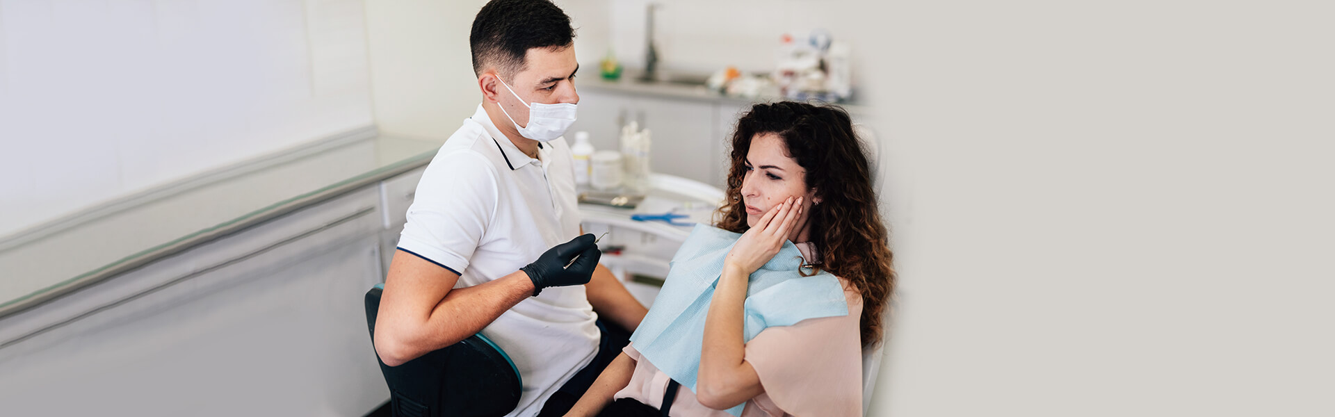 Dentist consulting a woman about her dental treatment options.